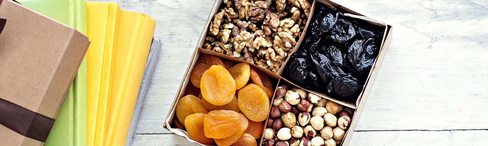 sectioned snack box containing dried fruits and nuts sectioned snack box containing dried fruits and nuts