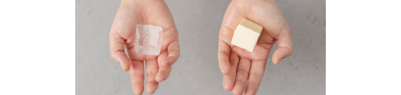 Ice and butter in hands Ice and butter in hands