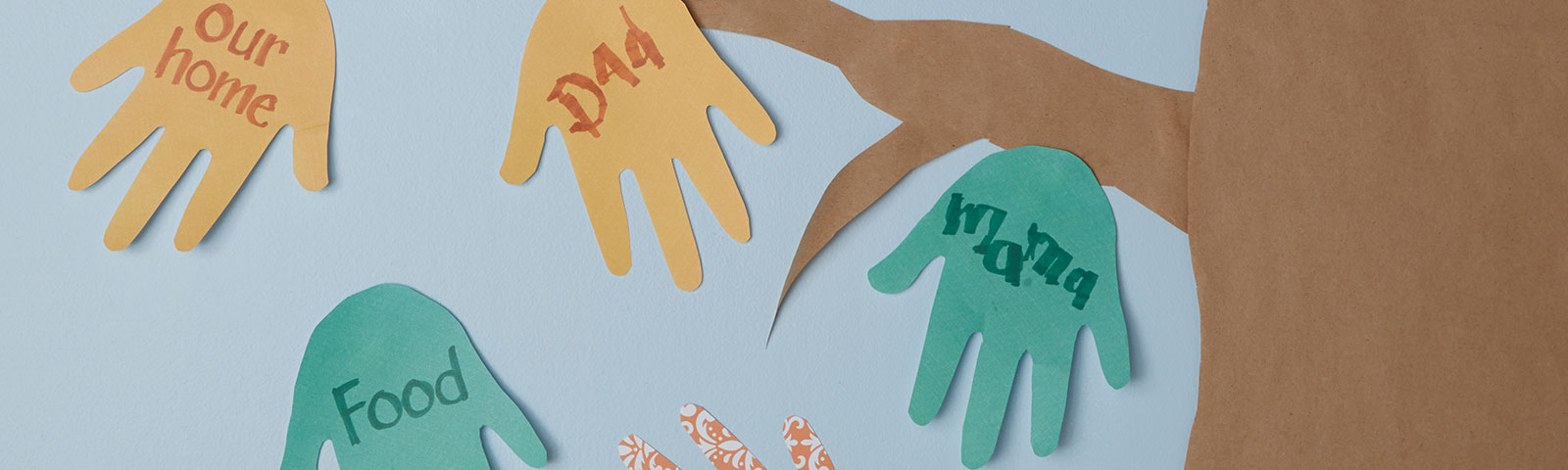 Cutout paper hands being used as leaves on a large paper tree. Each hand labeled with something to be thankful for. Cutout paper hands being used as leaves on a large paper tree. Each hand labeled with something to be thankful for.