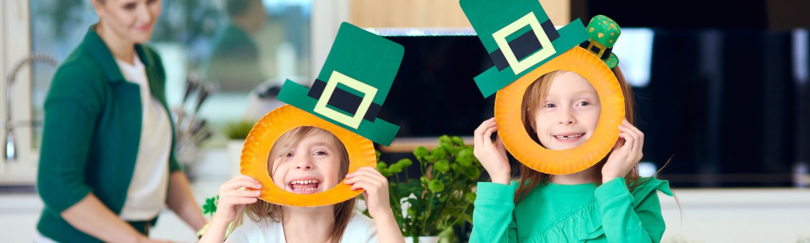Two kids making crafts for St. Patrick's Day Two kids making crafts for St. Patrick's Day