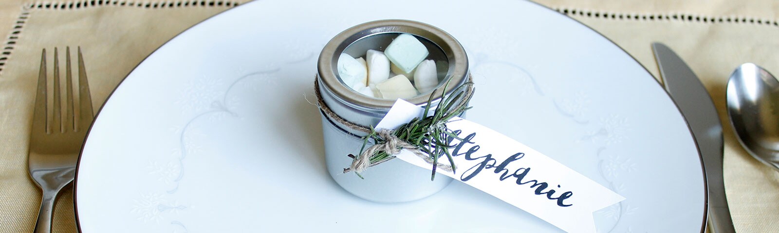 Party favor in tin container with name card