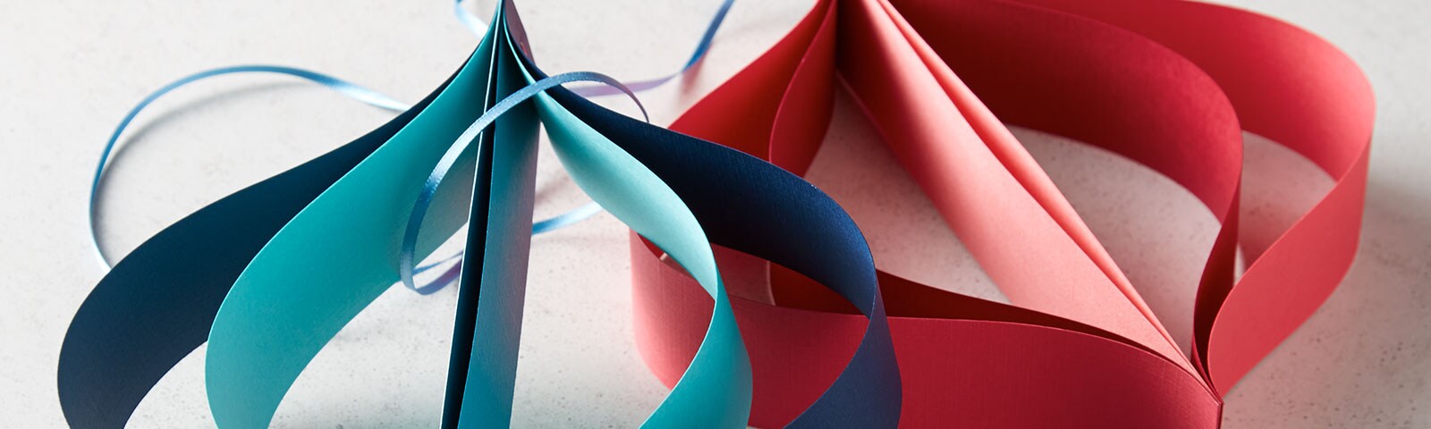 Finished blue and red oversized paper ornaments