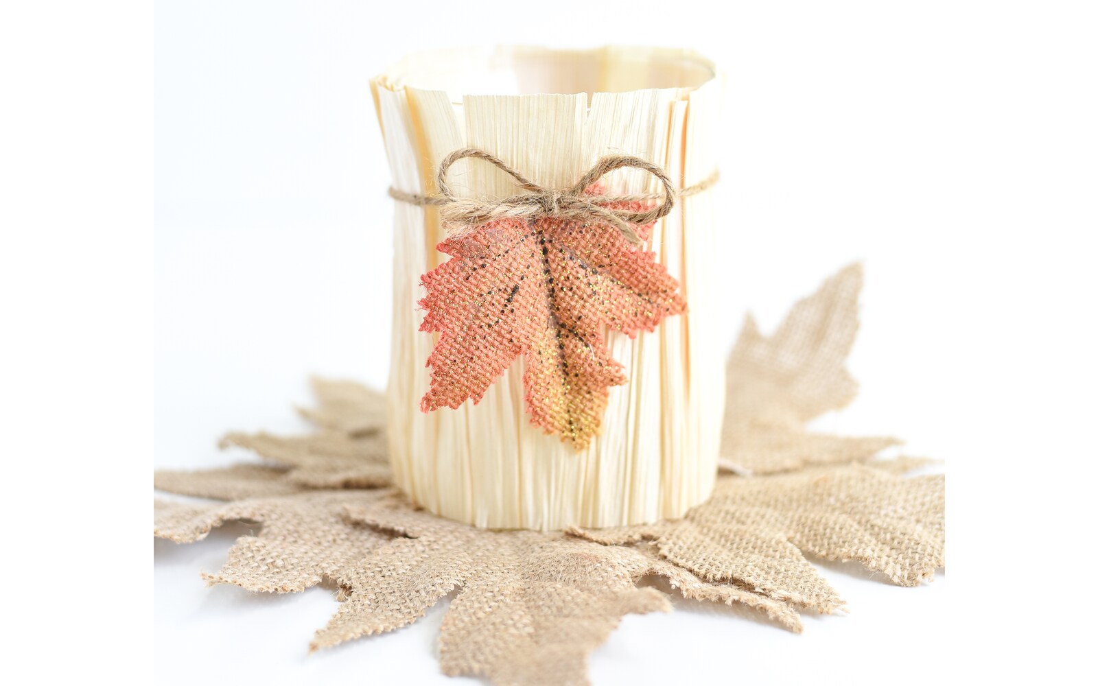 DIY vase made using a cornhusk and faux leaves