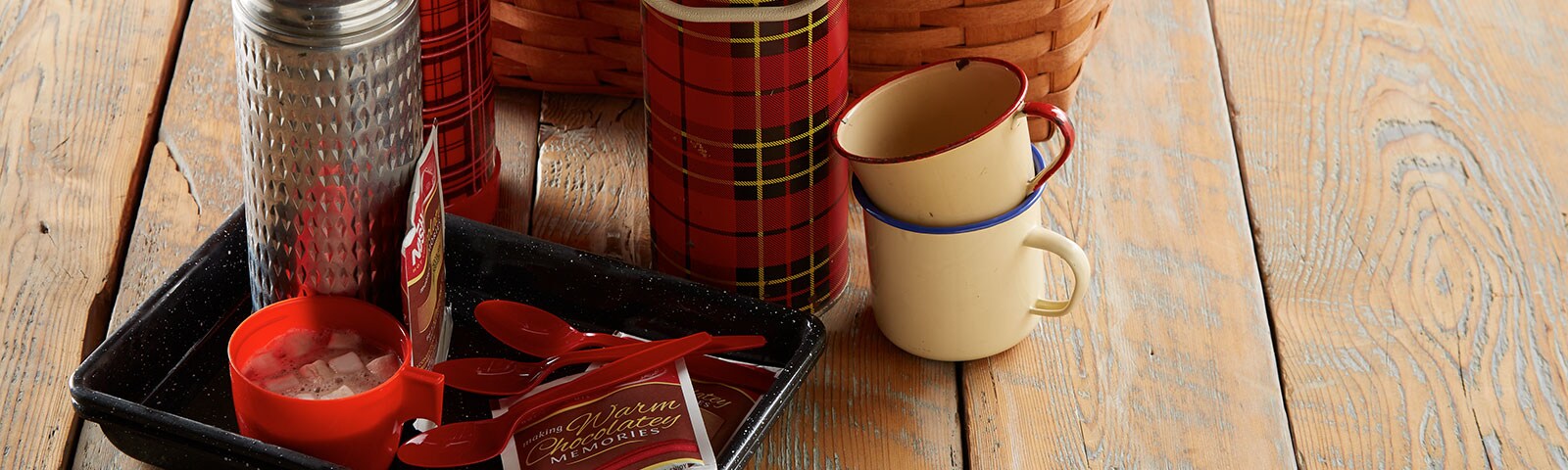 Hot cocoa in mugs and thermos Hot cocoa in mugs and thermos