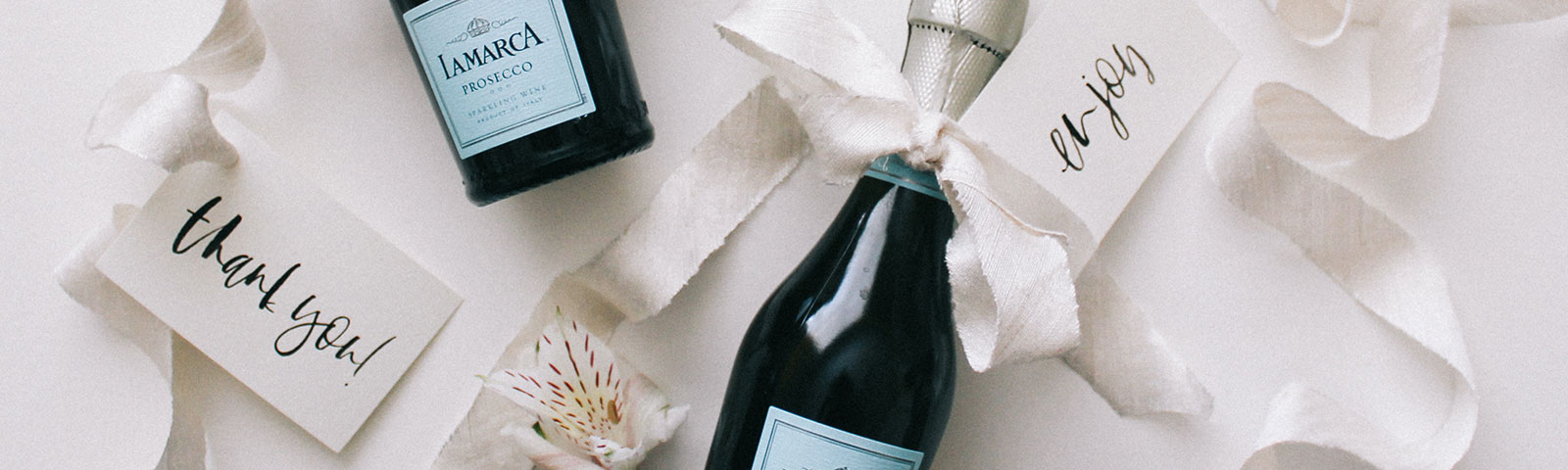 Champagne bottles with tags
